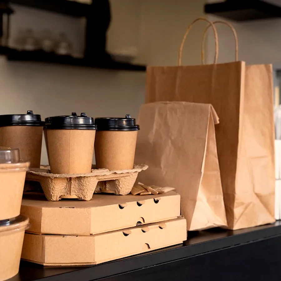 Takeaway pizza boxes and coffee at Stone Milled